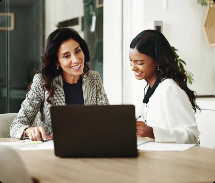 Image of two finance leaders setting up Kyriba's TAI product and implementing complex workflows in minutes