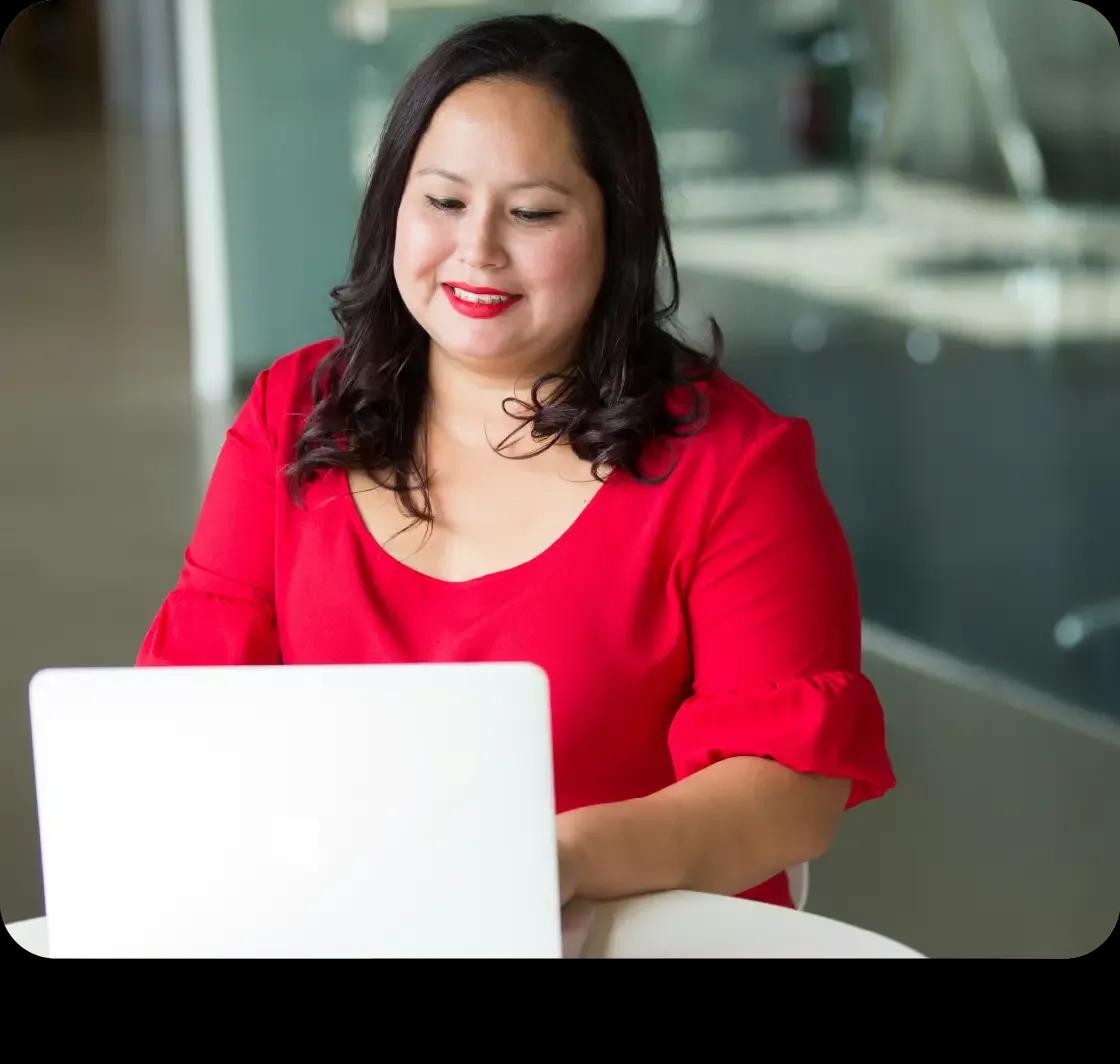 Image of a treasury manager working on her laptop