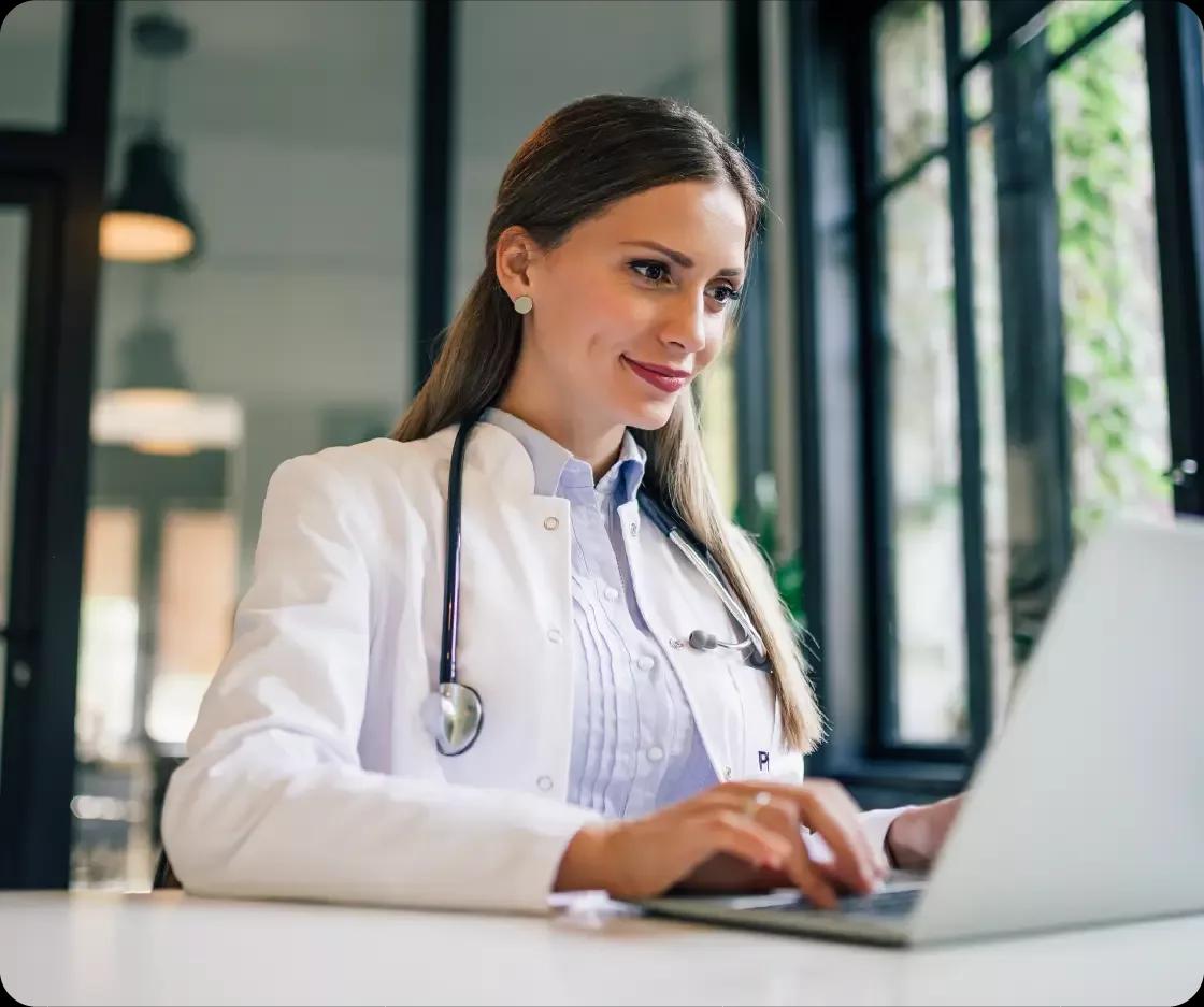 Healthcare professional working at her desk