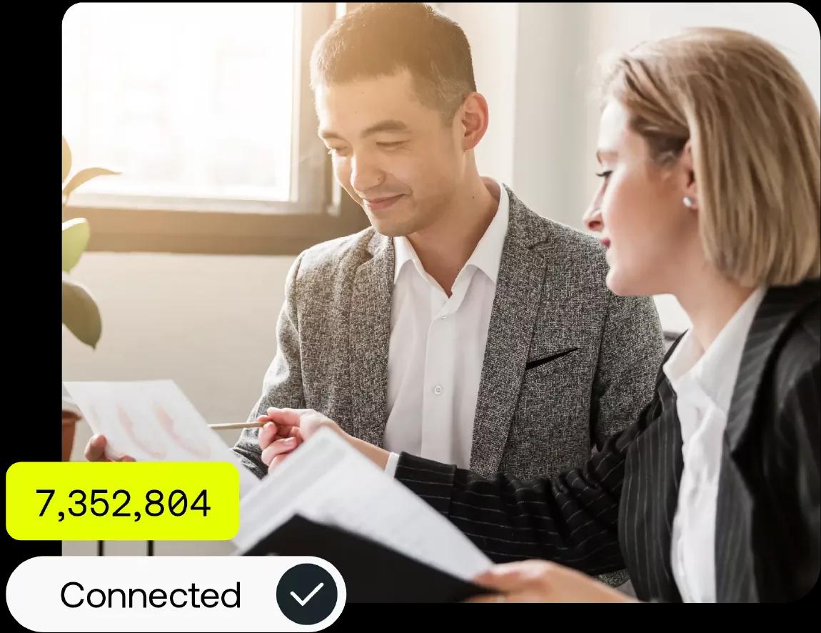 Image of a treasury team working on the Kyriba platform to connect all of their banks in one centralized platform