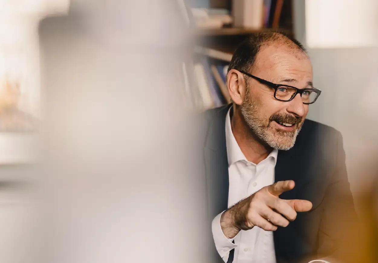 Image of a CFO leading a meeting