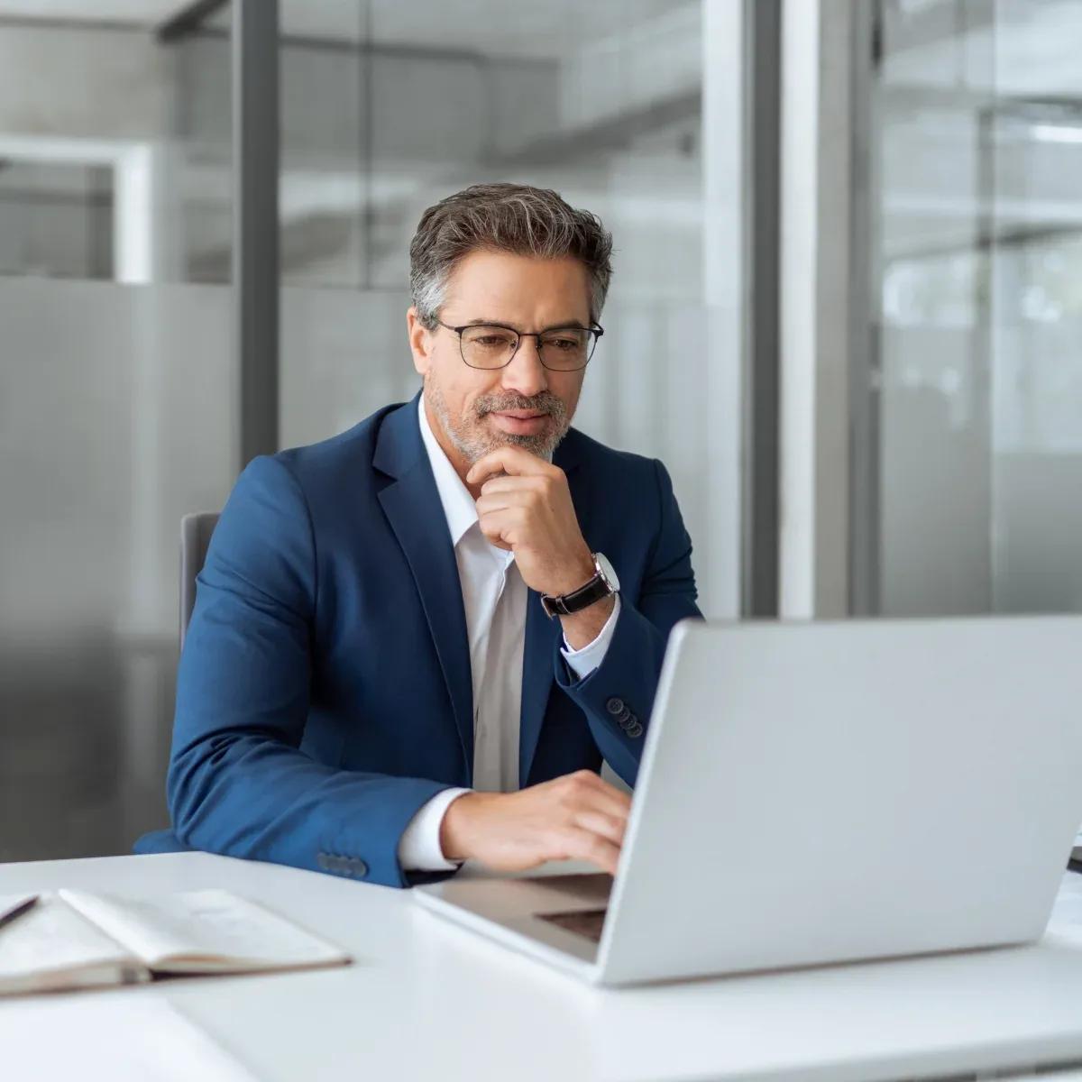Image of a CFO using the Kyriba platform to manage payments across ERPs, entities, and banks, all from a single payment center, for enhanced efficiency and control.