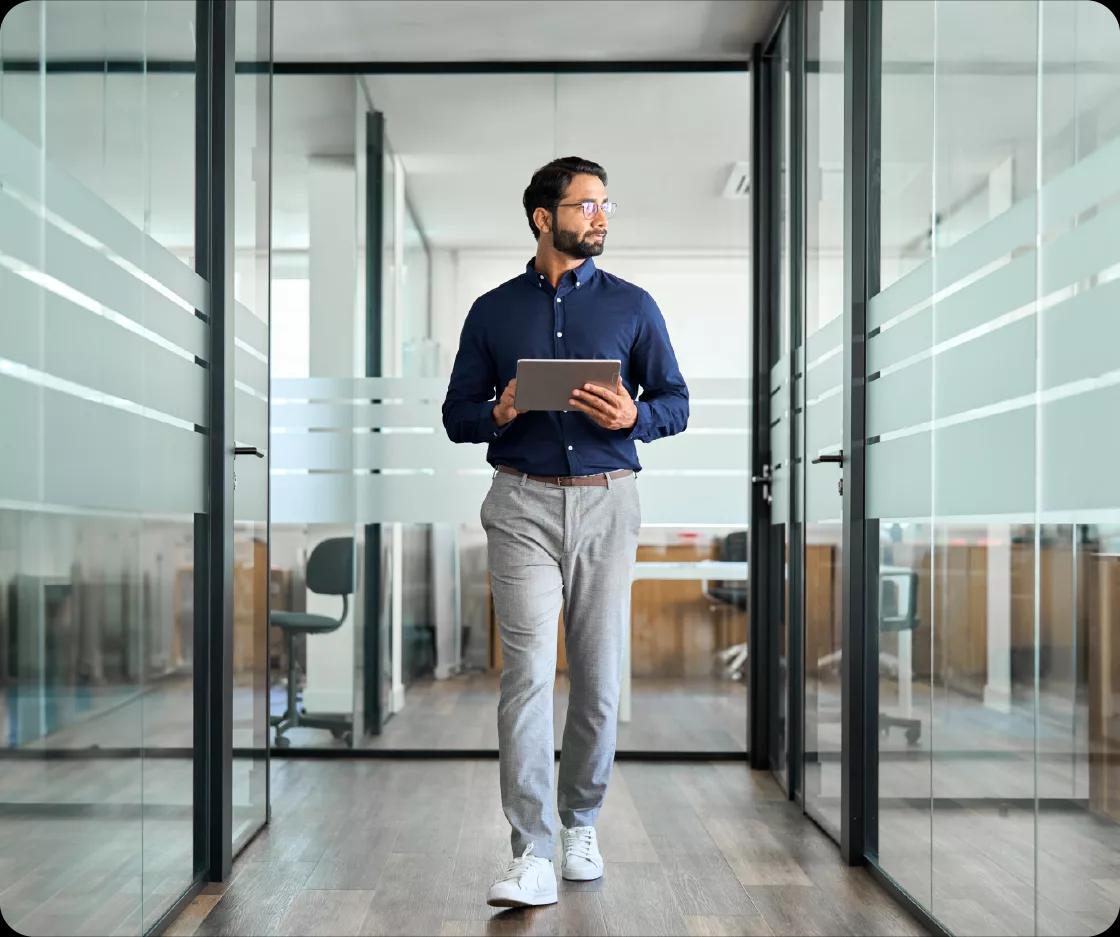 Image of a Kyriba customer in the real estate industry walking through the office