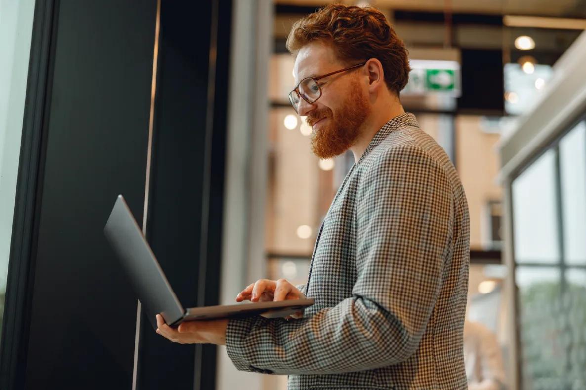 Image of a treasury leader working on his laptop