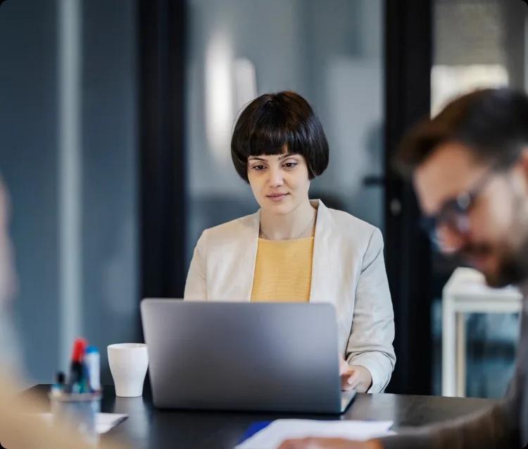 Image of a finance leader working on her laptop