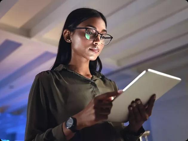 Image of a CFO using the Kyriba platform on her tablet to gain financial insights