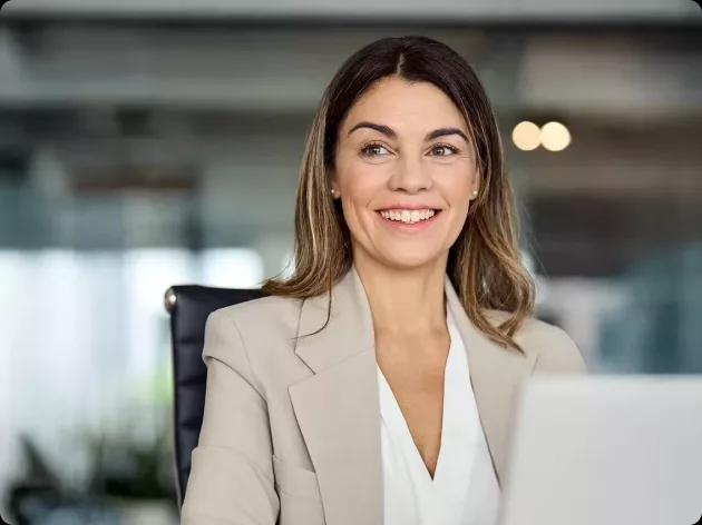 Image of a CFO and Kyriba customer working on her laptop
