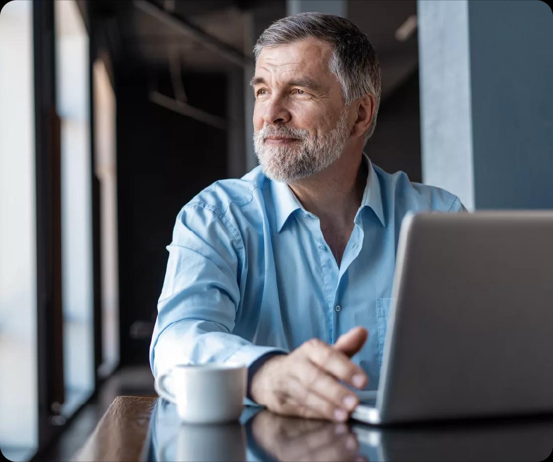 Image of a treasury manager working on his laptop