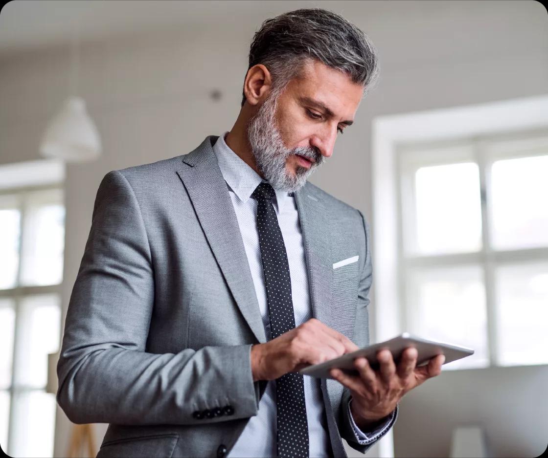 Image of a CFO using Kyriba on his tablet to gain insights