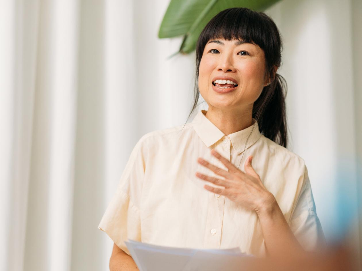 Image of a CFO leading a team meeting